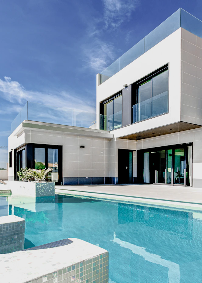 White contemporary house under a blue sky – The Design Organization