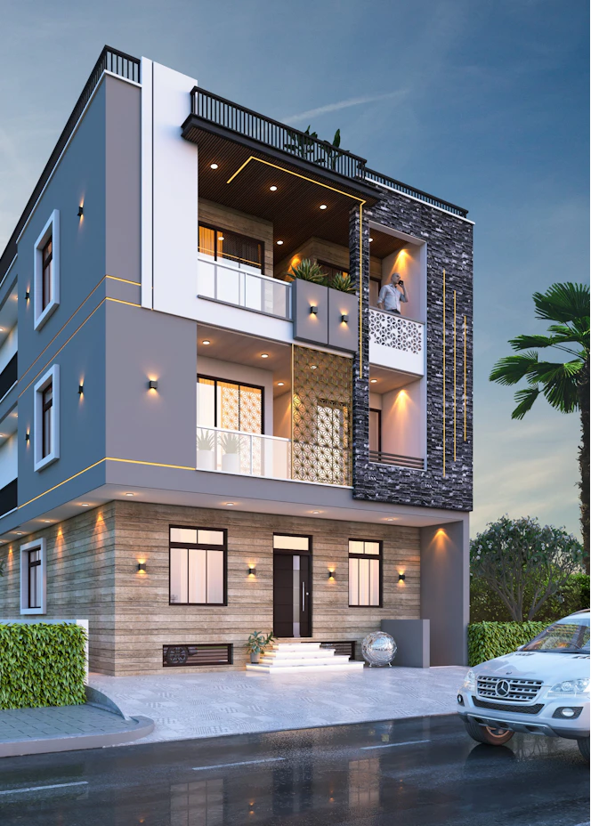 Three-storey house with stone cladding at dusk – The Design Organization